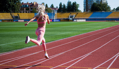 Fototapeta premium energetic and sporty. marathon speed energy. woman in motion. athletic lady
