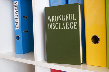 White shelf with book about wrongful discharge.