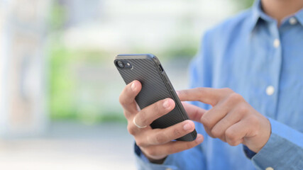 Hands Close Up of African Woman using Smartphone 