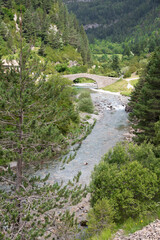 Meadows, lakes, rivers, woods  and mountains  in the Aragonese Pyrenees bordering the French border