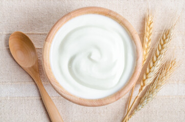 Greek yogurt in a wooden bowl.