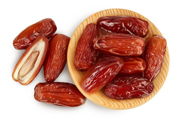 Dates in wooden bowl isolated on white background with clipping path. Top view. Flat lay