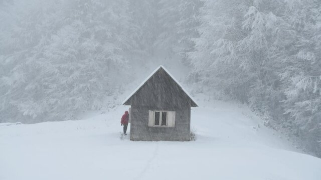 Fantastic winter footage with wooden cabin in snowy mountains
