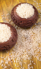 Uncooked dry rice in wooden bowl, Healthy food. Copy space.