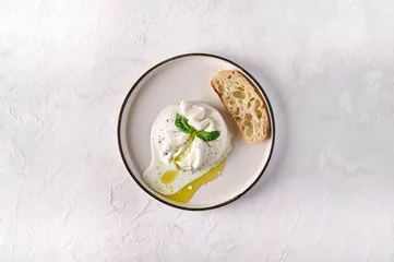 Fotobehang Italian burrata cheese with ciabatta bread and olive oil on white plate. Top view, copy space © Vitaliy