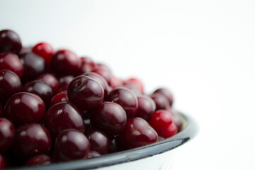 Cherry on a white background, juicy cherry for a photo wallpaper in your kitchen.
