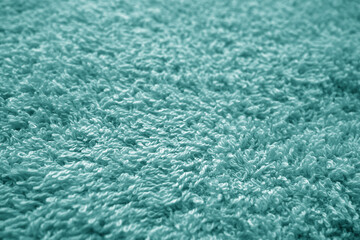 Bath towel texture with blur effect in cyan color.