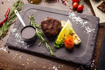 Black Angus Chateaubriant steak. Tenderloin from Brazil. Delicious healthy traditional food closeup served for lunch in modern gourmet cuisine restaurant