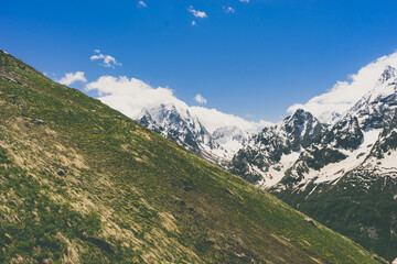 Great nature mountain landscapes. Fantastic perspective of caucasian snow inactive volcano Elbrus and clearly blue sky background. Russia