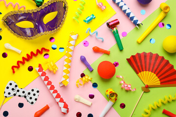 Flat lay composition with carnival items on color background