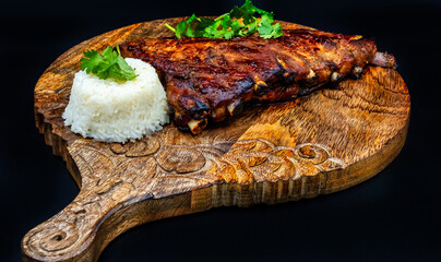 Baked pork ribs with sauce and rice