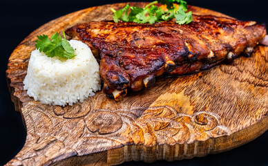 Baked pork ribs with sauce and rice