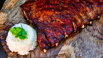 Baked pork ribs with sauce and rice
