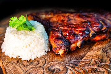 Baked pork ribs with sauce and rice
