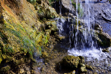 Jets of clean and cold spring water of Plakun waterfall