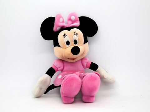 Minnie Mouse plush doll. Toy. Cartoon characters from Walt Disney Pictures Studios. Minnie is Mickey Mouse's girlfriend. Soft toy for children.