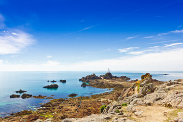 La Corbiere lighthouse on the south west corner of Jersey, Channel Islands, Britain, at low tide.