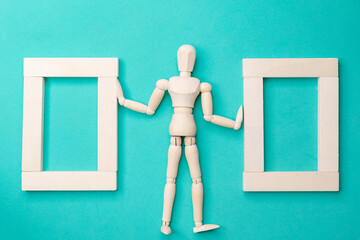 Concept love of education and business. Wooden humen and rectangle on green color background. Flat lay copy space style.