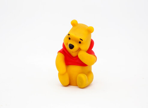  Winnie the Pooh. Teddy bear belonging to Christopher Robin. Honey loving yellow bear. Walt Disney character from books, movies and television series. Toy for young children. Plastic doll.