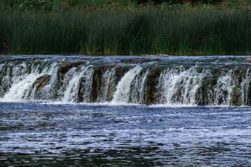 Fototapeta premium low and wide waterfall on the river