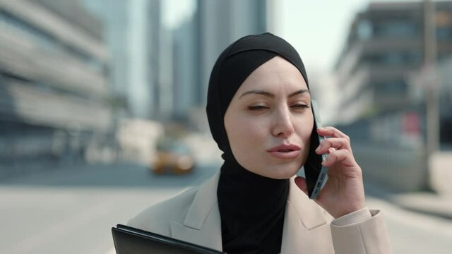 Business Woman In Hijab Talking On Mobile On Street