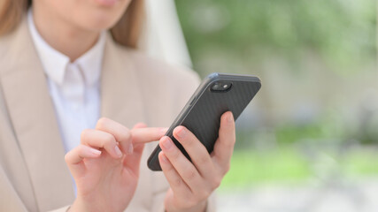 Hands Close up of Businesswoman using Smartphone 