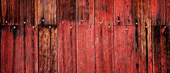 Old Barn in Field in Late Fall Autumn Brown Grass Weathered Red Wood