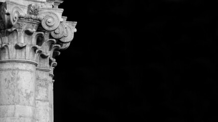Classical architecture in Venice. Corinthian column and capital from Church of St Barnabas facade, erected in the 18th centry (Black and White with copy space)
