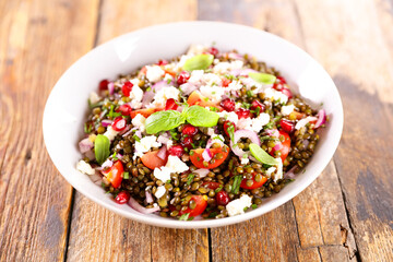lentil salad with tomato, cheese and pomegranate
