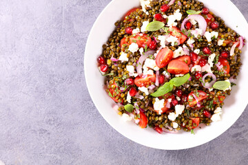lentil salad with tomato, cheese and pomegranate
