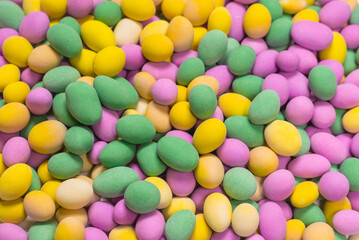 Group of colorful peanuts in glaze.