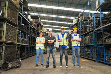 Man and woman work together, diversity of full body of Caucasian and Asian engineer worker men and woman stand and crossed arms  in factory-warehouse