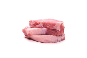 Raw pork pieces isolated on a white background.