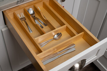 Wooden drawer with modern cutlery fork spoon white silver