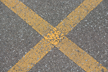 lines on asphalt - parking spot lines cracked yellow paint