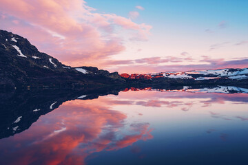 Lake near the Trolltunga in Norway during sunet