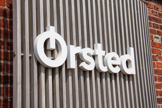 &Oslash;rsted Orsted Oersted trademark logotype. Danish renewable company power plant factory producing electricity and energy from wind turbines. Copenhagen, Denmark - July 25, 2021.
