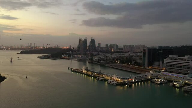 sunset evening illumination singapore city famous sentosa island dock aerial panorama 4k 