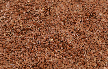 Organic flaxseed for herbal decoctions or granola. Background and texture, full frame.