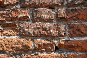 Section of the wall made of old red brick. Background.