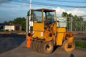 Bulldozer for paving yellow asphalt. Heavy machinery for road repair.