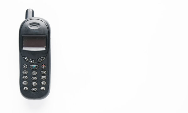 A picture of old obsolete smartphone on copyspace white background. Famous design in year 2000.