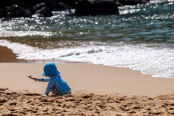 Child playing on the beach