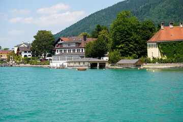 Fototapeta na wymiar Landscape shots of the Bavarian Tegernsee lake and its shores with mountains in the background
