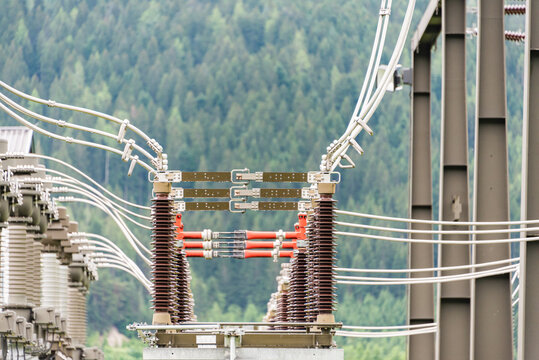 The electric power station transformer, high-voltage equipment object. Distribution electric substation with power lines. Busbar, autotransformer, supports, switchgear.