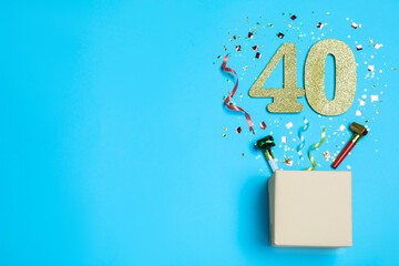 Flat lay composition with decor and numbers on light blue background, space for text. 40th birthday party