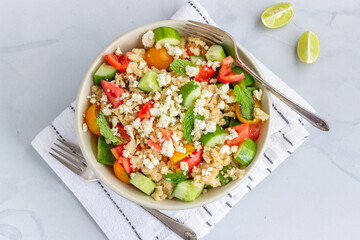 Healthy Bulgur Salad with Veggies in a Bowl Top Down Vertical Photo