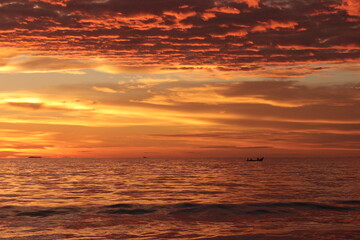 Sunset. Dramatic sunset sky with clouds. Dramatic sunset over the sea