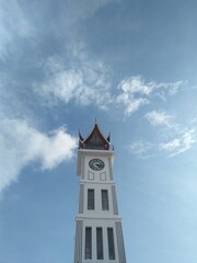 Fototapeta na wymiar Jam Gadang clock tower of Bukittinggi. The structure was built in 1926, during the Dutch colonial era, as a gift from Queen Wilhelmina to the city's controleur.