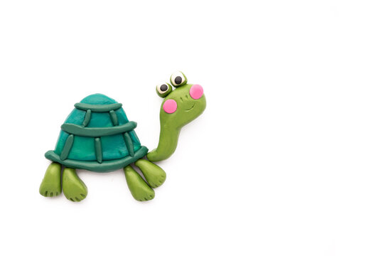 cute turtle made of plasticine on a white background